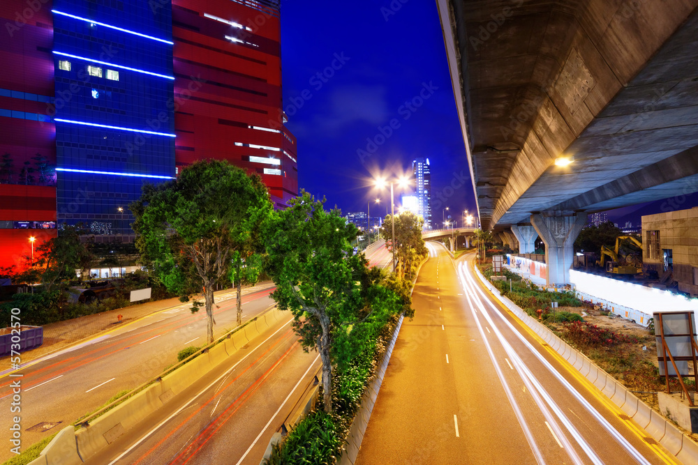 moving car with blur light through city at night