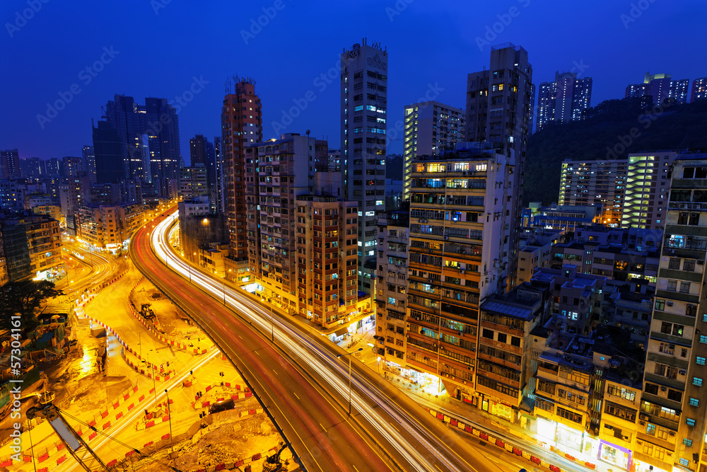 Colorful city night with lights of cars motion blurred in hong k