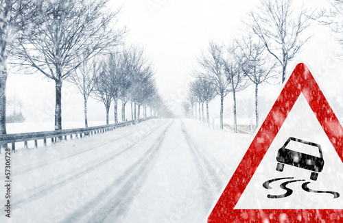 Snowy road with traffic sign