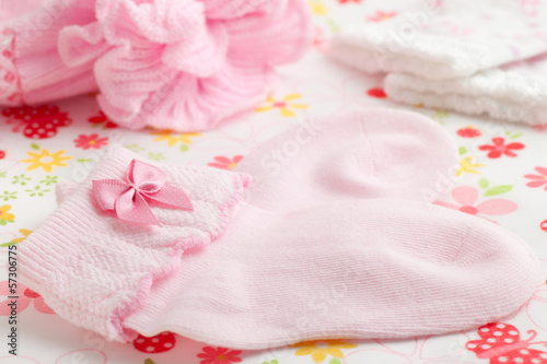 Pink baby socks and newborn hat