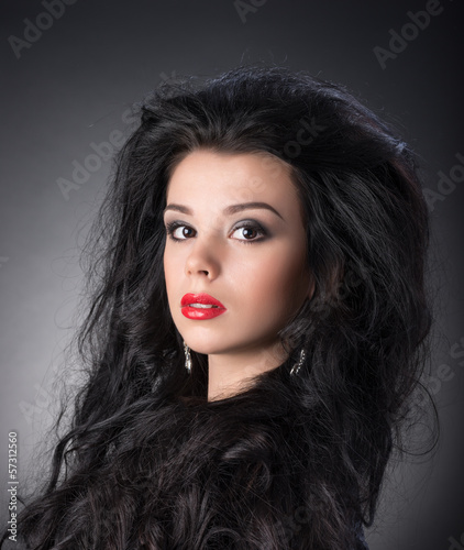 Fototapeta Naklejka Na Ścianę i Meble -  Portrait of young brunette girl in fashion style