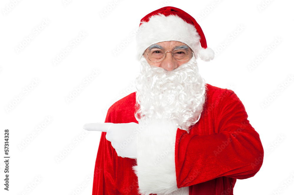 Santa claus pointing away over white Santa claus pointing away over white