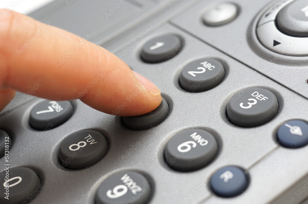 man hand is dialing a telephone number man hand is dialing a telephone number