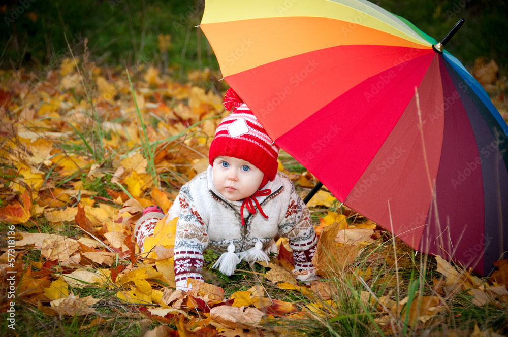 Little cute girl with colorful umbrella as a rainbow Little cute girl with colorful umbrella as a rainbow