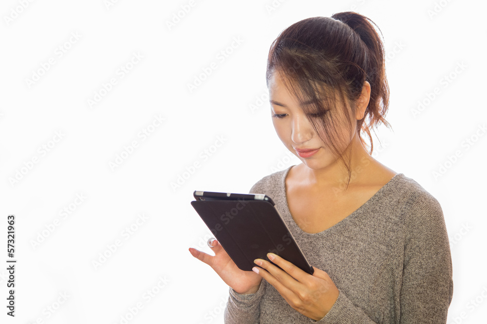 Asian young woman using iPad tablet pc ebook Asian young woman using iPad tablet pc ebook
