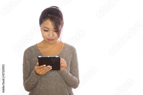 Asian young woman using iPad tablet pc ebook photo