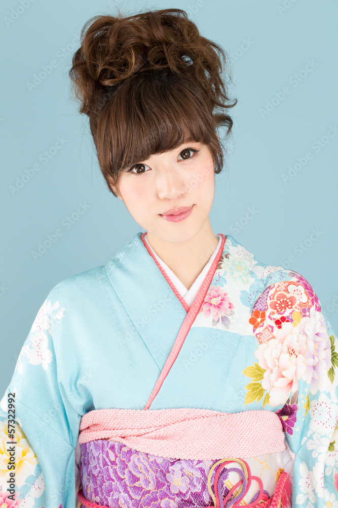 Beautiful asian kimono woman on blue background Beautiful asian kimono woman on blue background