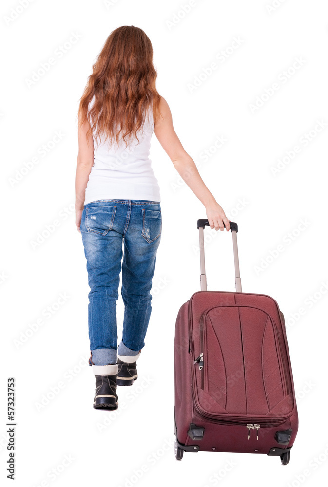 back view of walking woman with suitcase back view of walking woman with suitcase