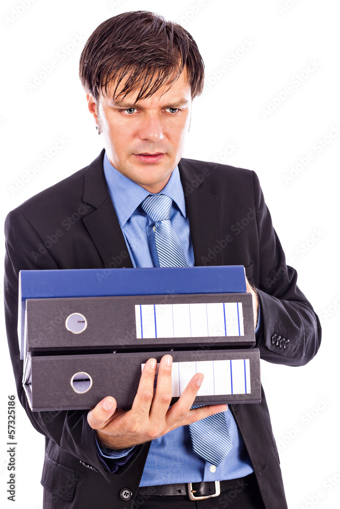 Young businessman holding many folders Young businessman holding many folders