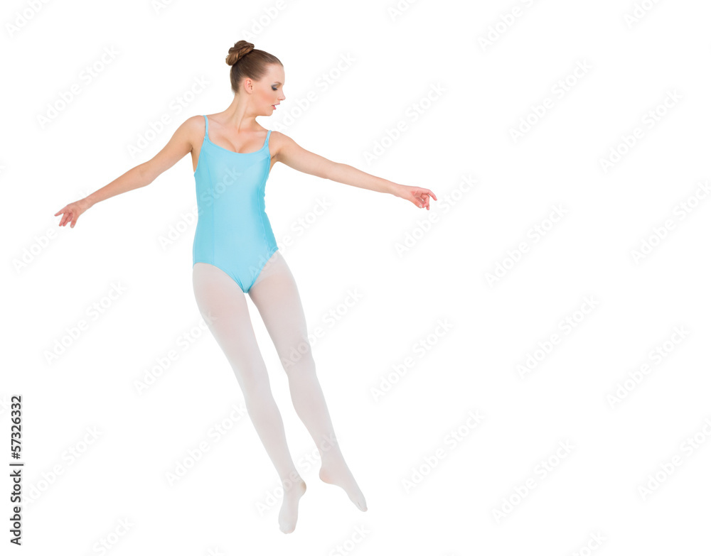 Serious pretty ballerina jumping
