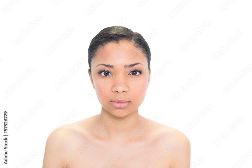 Serious young dark haired model posing looking at camera Serious young dark haired model posing looking at camera