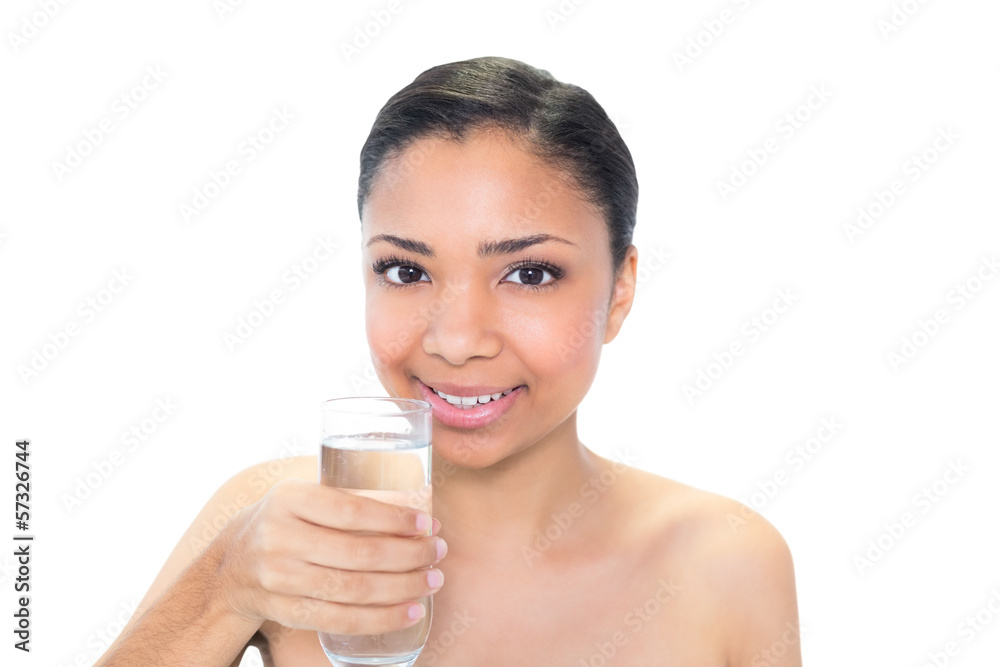 Cheerful young dark haired model holding a glass of water Cheerful young dark haired model holding a glass of water