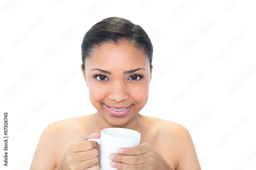 Content young dark haired model holding a mug of coffee Content young dark haired model holding a mug of coffee