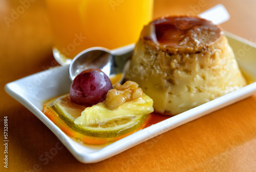 Jelly and fruit dessert with nuts and orange juice