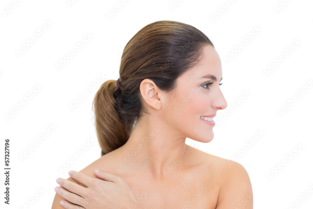 Cheerful bare brunette turning head right Cheerful bare brunette turning head right