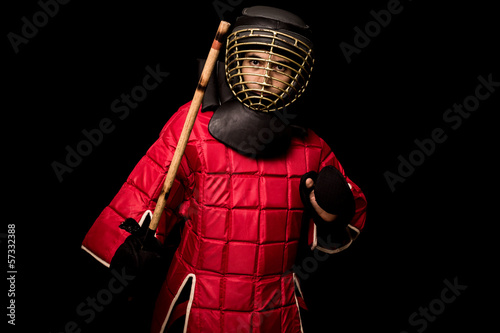 Eskrimador stick-fighter on black background photo