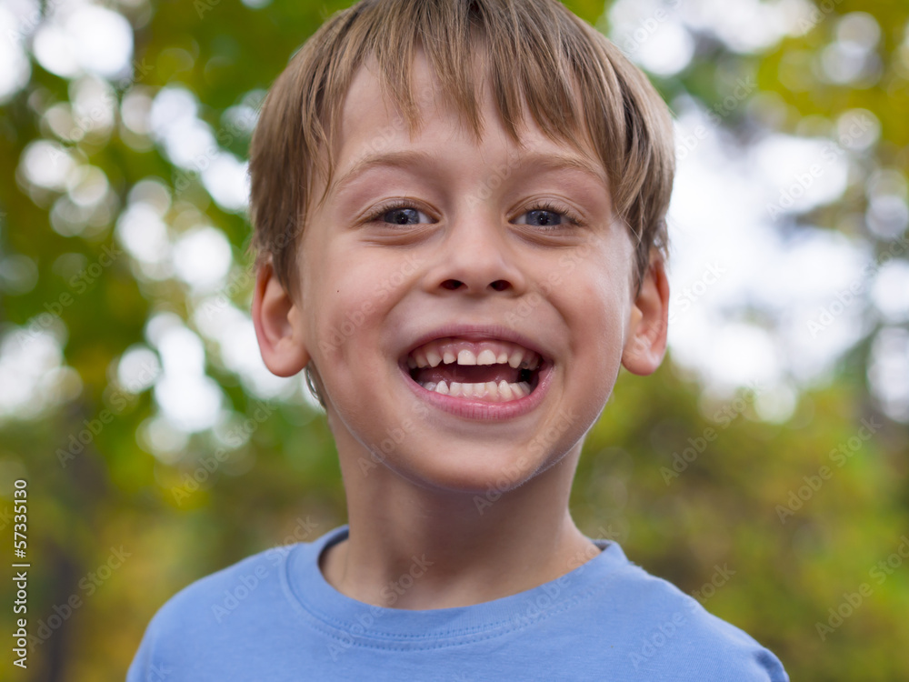 portrait of a happy boy in the park portrait of a happy boy in the park