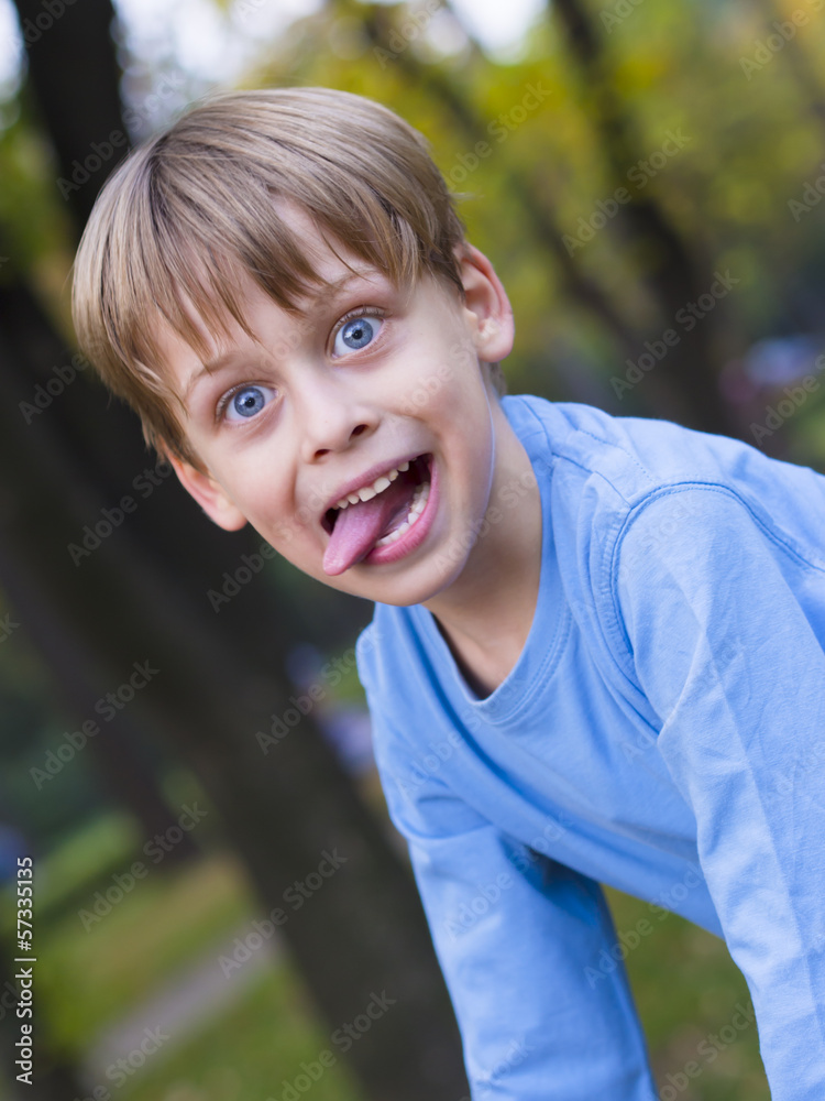 portrait of a happy boy in the park portrait of a happy boy in the park