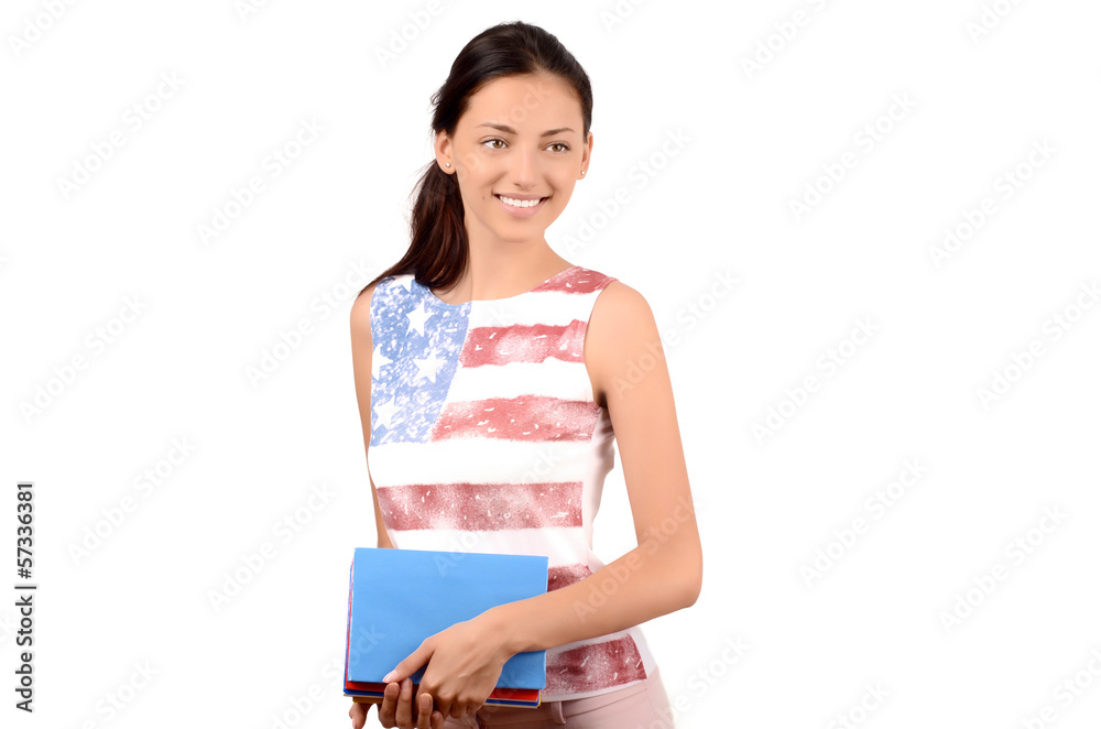 American student holding English books. USA flag on her blouse. American student holding English books. USA flag on her blouse.