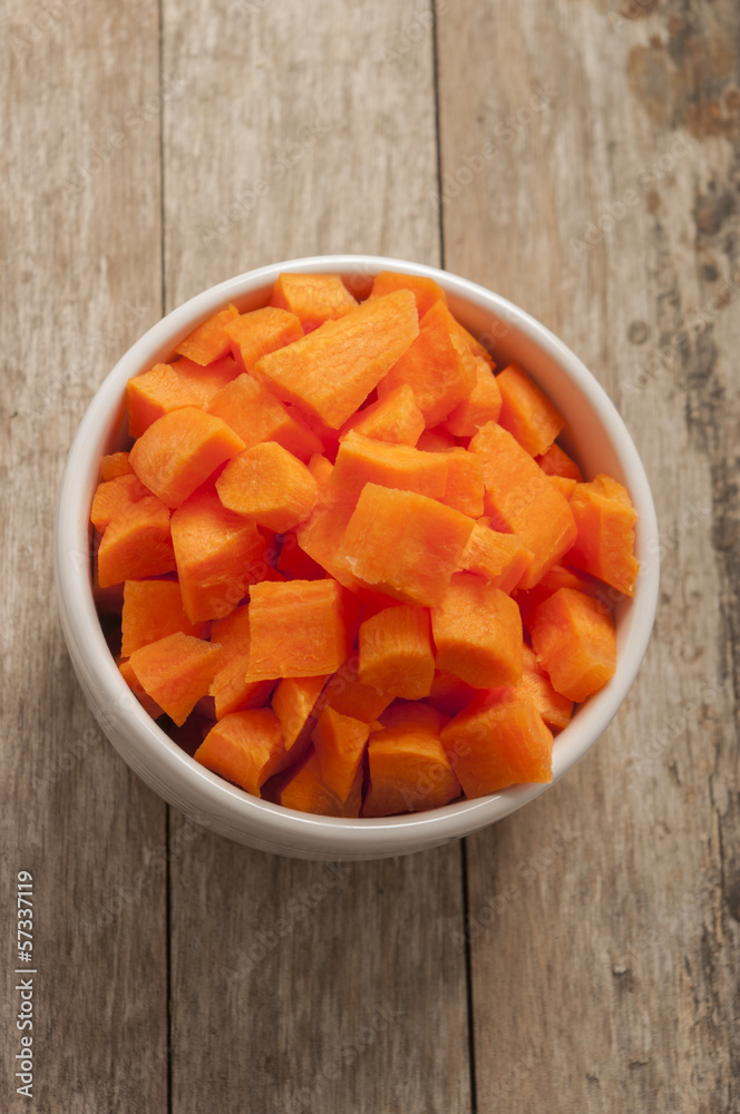 cut carrot on wooden background