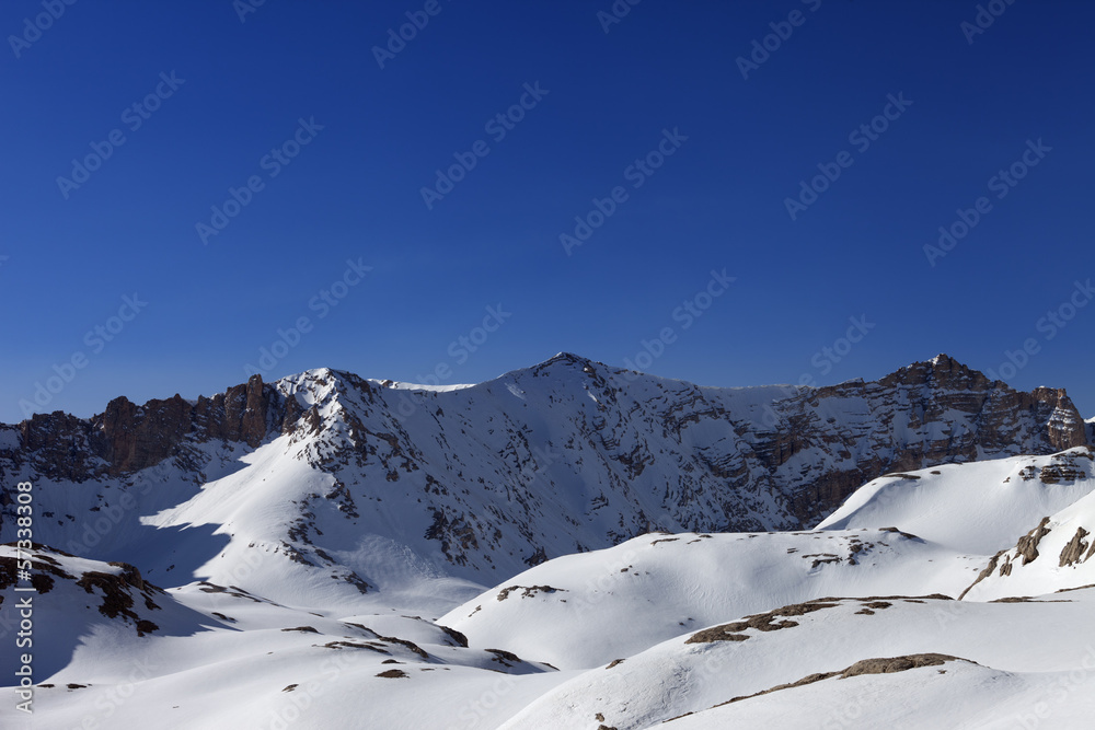 Snowy mountains and blue sky in morning