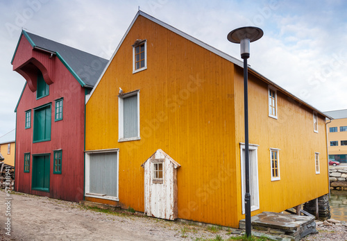 Street with red and yellow wooden houses in Norway