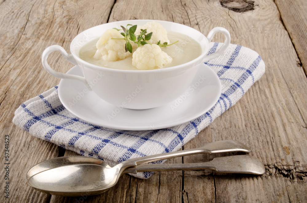 cauliflower soup in a white bowl cauliflower soup in a white bowl