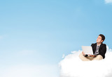 Businessman sitting on cloud with copy space