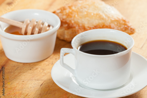Fototapeta Naklejka Na Ścianę i Meble -  Breakfast including coffee, bread, honey.