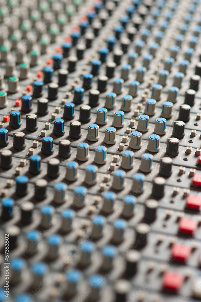 Detail of a music mixer in studio, closeup. Detail of a music mixer in studio, closeup.