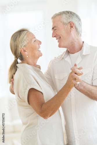 Happy Couple Dancing At Home