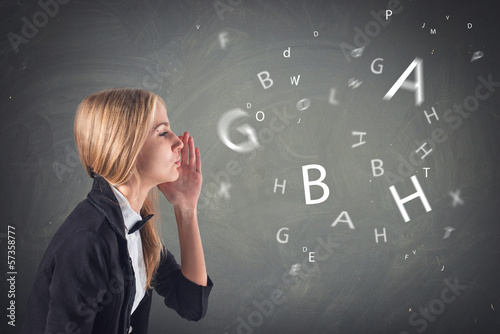 woman with her hand on the face talking secret with letters
