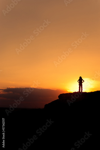Silhouette of hiking woman with backpack