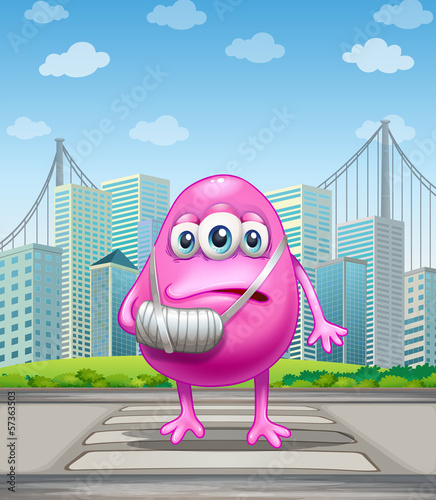 An injured pink monster crossing the street