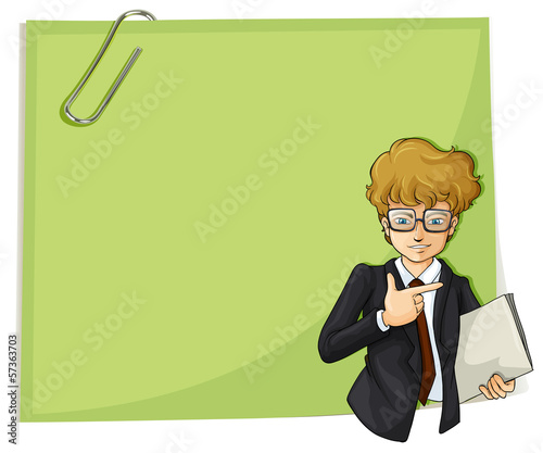 A handsome young businessman in front of an empty signage