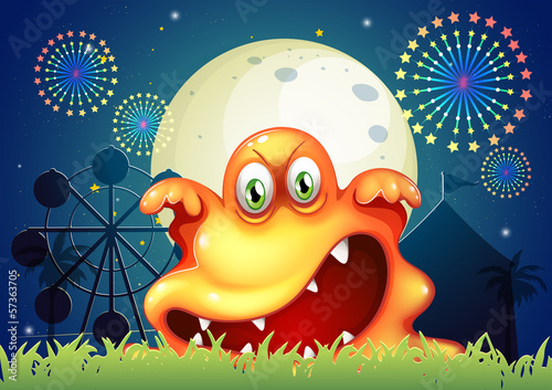 An amusement park with a scary orange monster