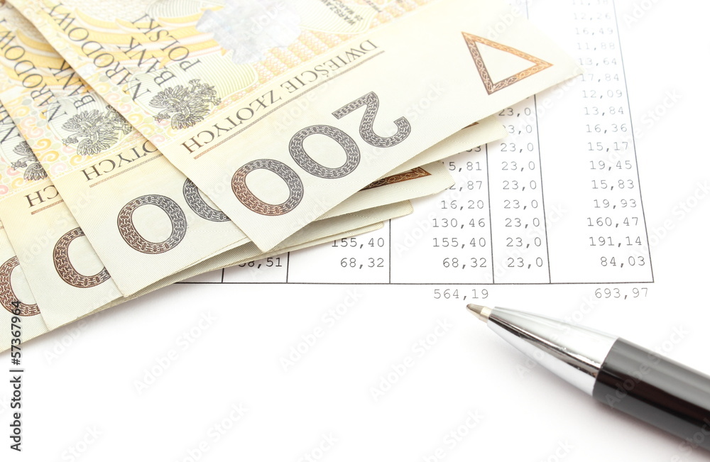 Money and ballpen lying on spreadsheet Money and ballpen lying on spreadsheet