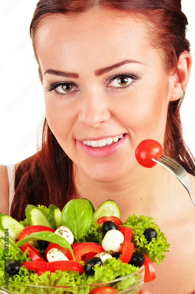 Young woman eating vegetable salad Young woman eating vegetable salad