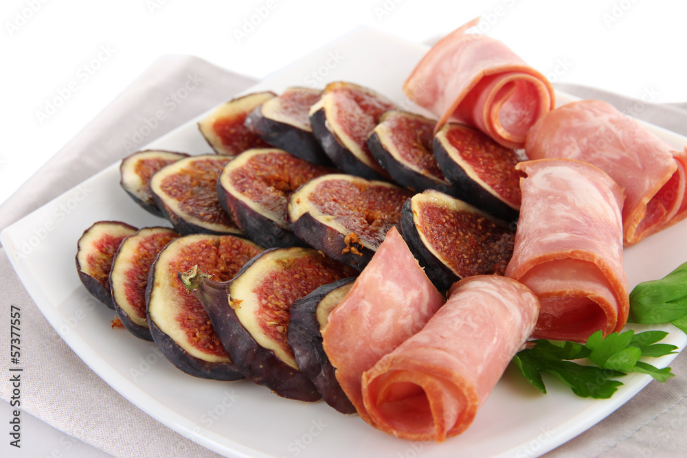 Tasty figs with ham, isolated on white Tasty figs with ham, isolated on white