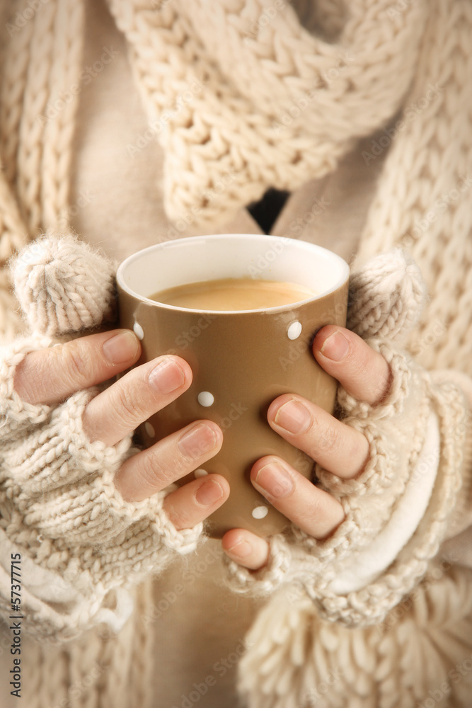 Female hands with hot drink, close-up Female hands with hot drink, close-up