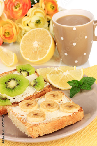 Delicious toast with fruits on plate close-up