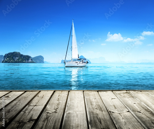 Canvas yacht and wooden platform