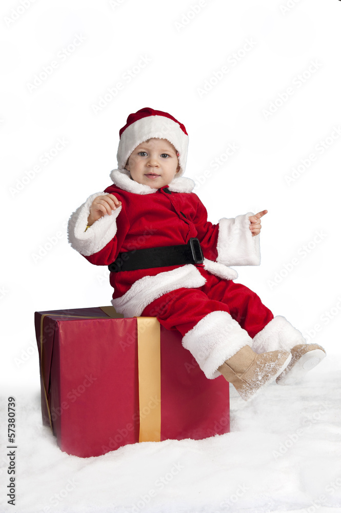 little santa claus seated on a christmas present i little santa claus seated on a christmas present i