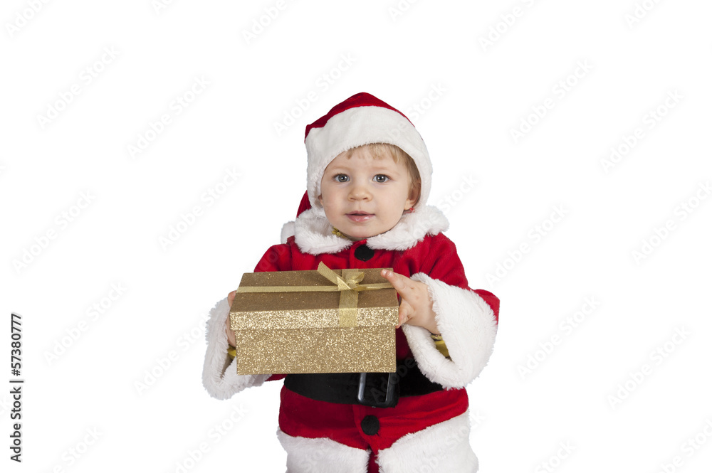 little toddler in xmas outfit giving a present