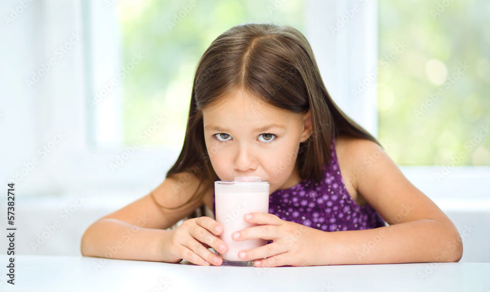 Little girl with a glass of milk Little girl with a glass of milk