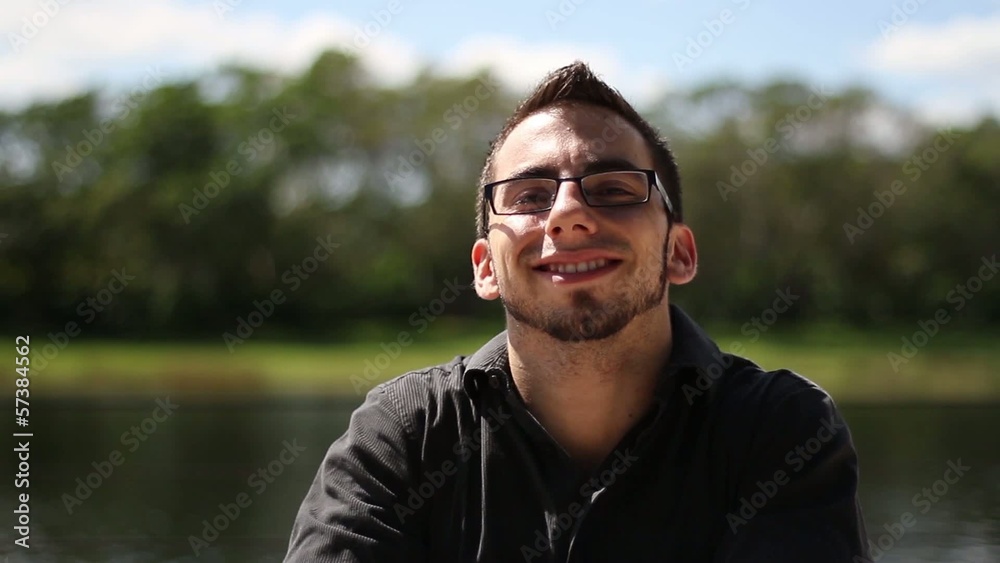 handsome businessman smiling to the camera handsome businessman smiling to the camera