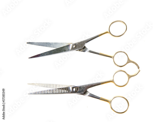 a pair of hair scissors on white
