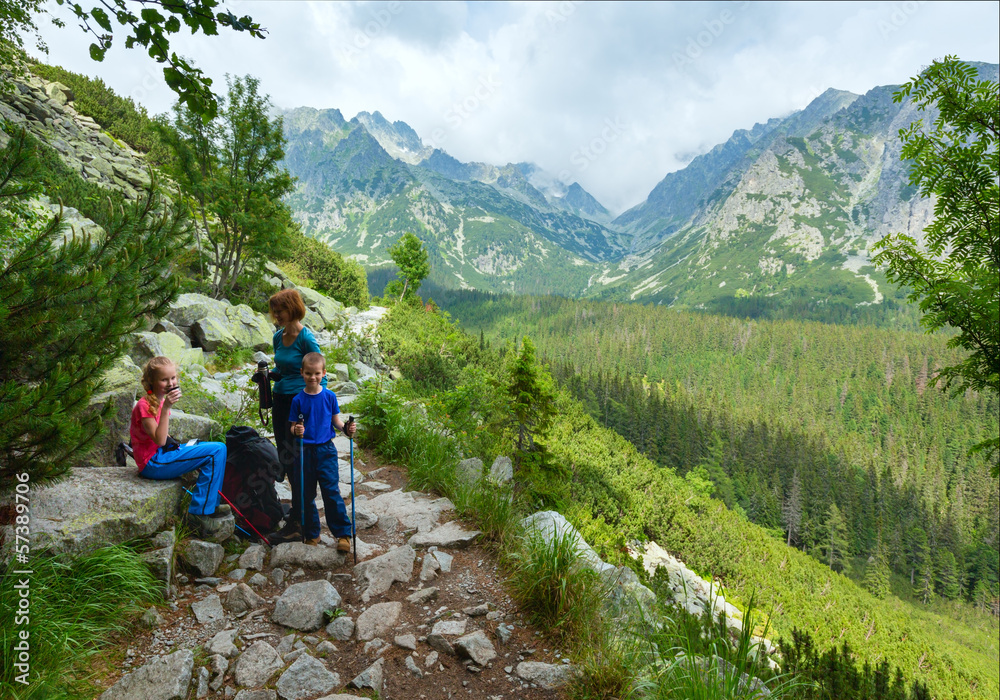 High Tatras (Slovakia) summer view and family on footway. High Tatras (Slovakia) summer view and family on footway.