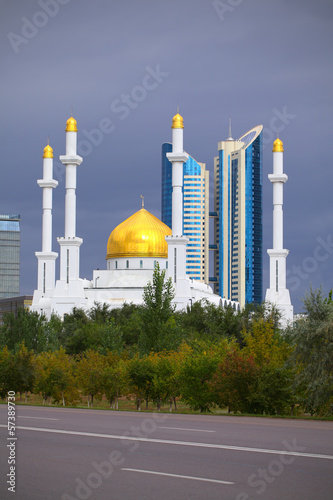 Mosque on a background of a modern city. photo