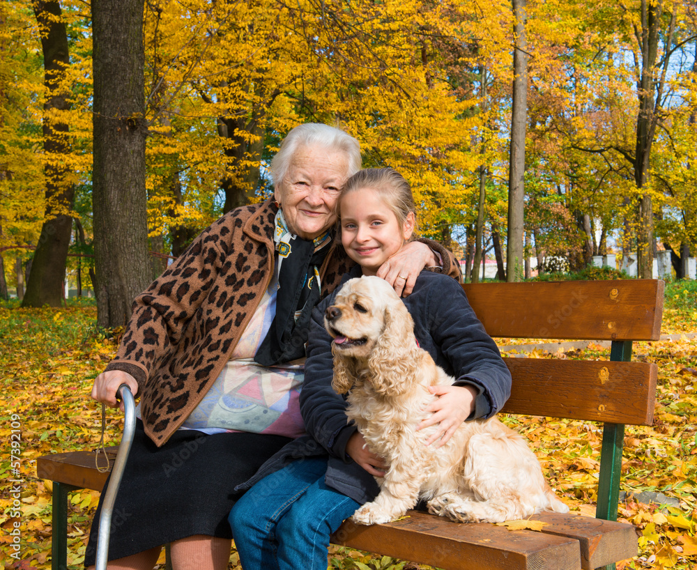 Grandmother and child sitting on the bench